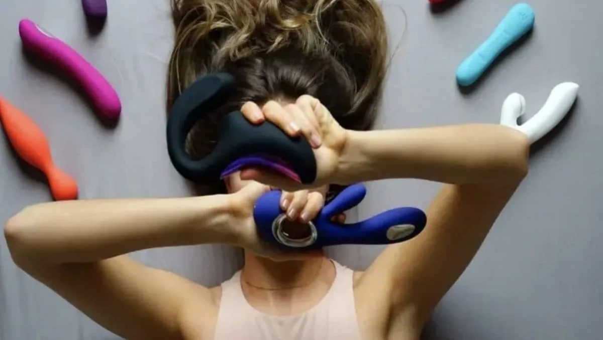 Escort girl from Dubai holding erotic toy
