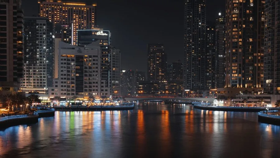 Dubai Marina at night with traffic lights and ref…